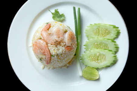 Thai style fried rice with shrimp or Khao Pad Goong on a white plateの写真素材