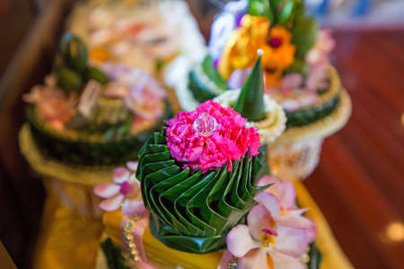 Pink flower with transparent diamond around with banana leafの写真素材