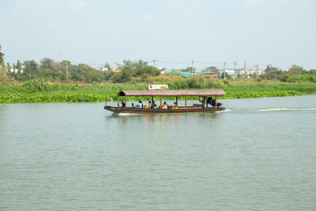 Nakhon Chai Si, THAILAND - February 10, 2019: Tourists boat of bangkok crosses the River in the evening on a Sunday, Nakhon Pathom Thailand.のeditorial素材