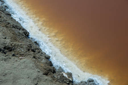 Process saline to be Salt scales crystallize in salt field, layer between clay and water.