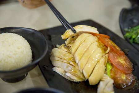 Sliced Hainan-style chicken with marinated riceの写真素材