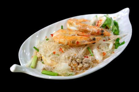 Spicy noodle salad with fresh shrimp on top, Thai Food.