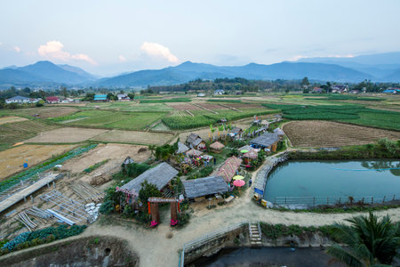 Nan / Thailand - December 12 2019: People's village in Pua district, bird eye view from Phuket Temple (Wat Phuket.) can see nice scenery of Rice fields and corn fields .のeditorial素材