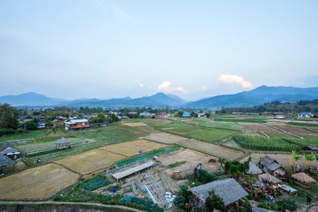 Nan / Thailand - December 12 2019: People's village in Pua district, bird eye view from Phuket Temple (Wat Phuket.) can see nice scenery of Rice fields and corn fields .のeditorial素材