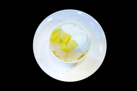 Ice cream topping with Palm seed in syrup and Sweet Potato Welding, in black isolated.の写真素材