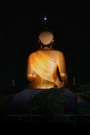 Spot light to Big back of Buddha and Buddha head wat in Thailand.の写真素材