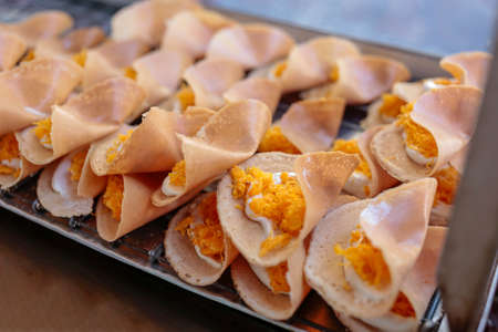 Thai street food kind of Thai crispy pancake, thai name Kanom Buang, focus selective.
