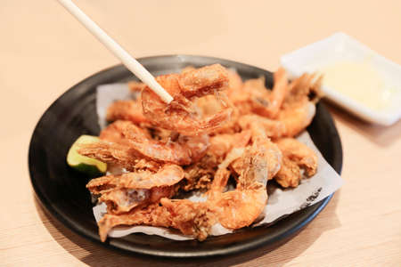Top view of assorted fried foods with shrimps, focus selective.
