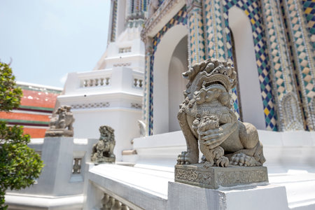 BANGKOK, THAILAND - April 23, 2017:Chinese lion statues at Wat Phra Kaew or the temple of the...