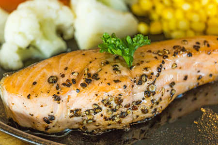 Crispy salmon and soy sauce background with corn and Cauliflower, focus selective.の写真素材
