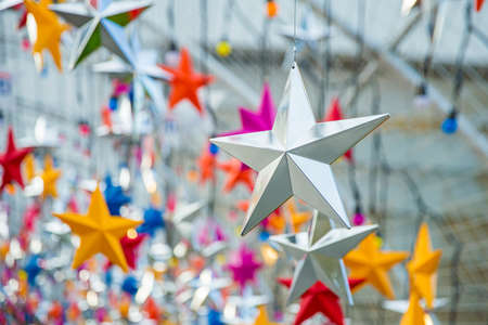 Background hanging decoration in the from of a voluminous five-pointed star.