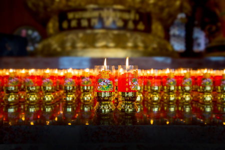 Nonthaburi, THAILAND - December 22, 2019: Lighting a lucky candle, Attraction and beautiful inside the Leng Nei Yi 2 (Barom Racha Kajanapisek Anusorn Canasongjennigairangsan temple), very famous for tourist.のeditorial素材