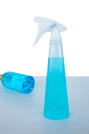 Blue liquid alcohol for cleaning in white plastic foggy sprayの写真素材