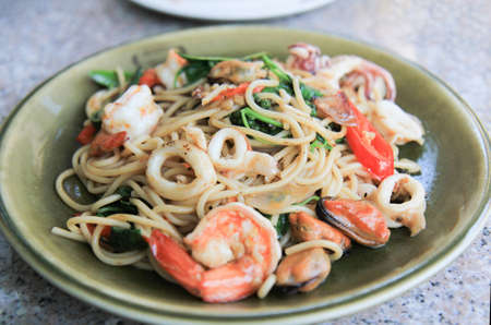 Seafood pasta Dish with Mixed Seafood with Mussels and prawn, focus selective.の写真素材