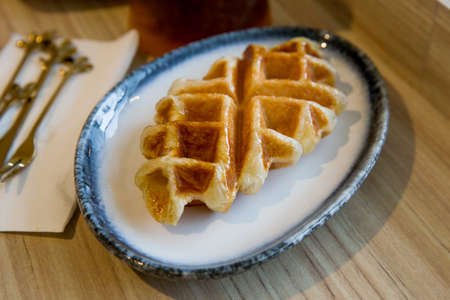 Top view of Plain Waffle on wooden surfaceの写真素材