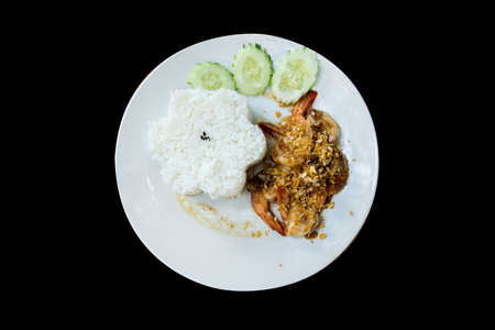 Die cut of Stir fried river shrimp with pepper and garlic on black isolated.の写真素材