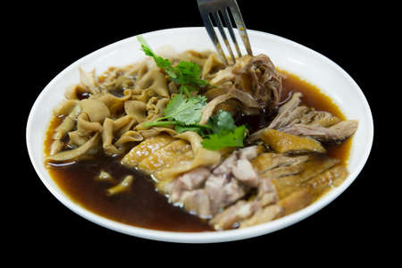 Top view of Steamed duck meat, duck meat and Duck Intestine, in Chinese brown soup, focus selective.