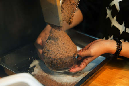 Top view of Bingsu or Korean shaved ice dessert with cherry whipped cream and sweetened condensed milk, focus selective.の写真素材