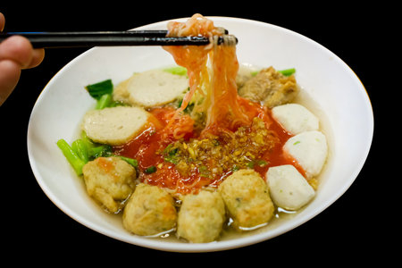 Top view of Fish Ball Noodles with chopsticks, focus selective