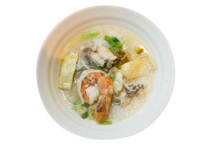 Top view of Porridge with fish with shrimp on white background, focus selective, focus selectiveの写真素材