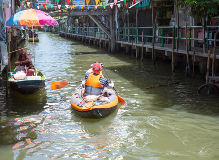 Bangkok / Thailand - June 19 2022: The foreigner exercise with canoe boat at Khlong Lat Mayom Floating Market very famous District of Bangkok, Thailandのeditorial素材