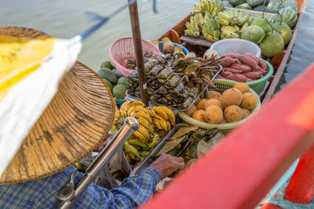 Picture of female trader in a boat, focus selective.の写真素材