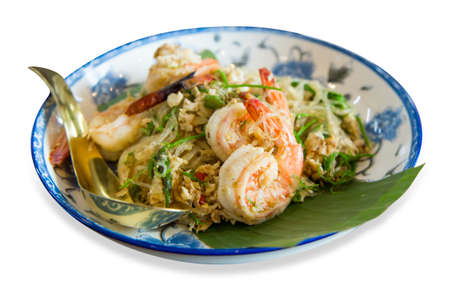Die cut of Stir Fried Glass Noodle with egg and shrimp put in blue and white porcelain on white isolated.の写真素材