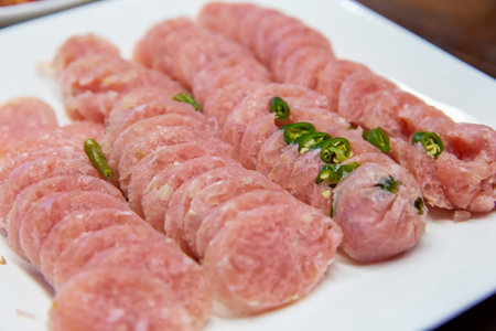 Sliced sour pork in a white plateの写真素材