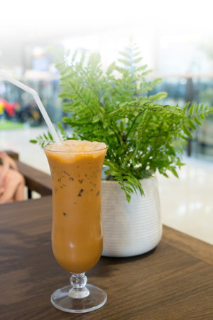 Milk tea or Teh Tarik on the wooden table.の写真素材