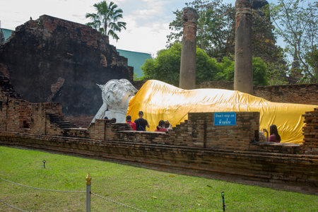 Ayutthaya Thailand - January 28 2022: Wat Yai Chimongkol white reclining Buddha Highlights of the Temple very famous in Ayutthaya Thailand.のeditorial素材