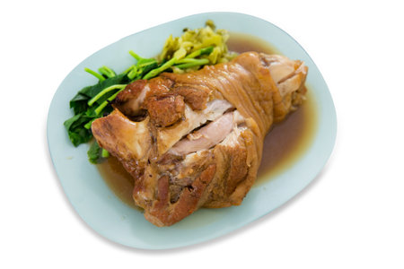 Die cut of Close up of chinese food pork knuckle in a plate on white isolated.の写真素材