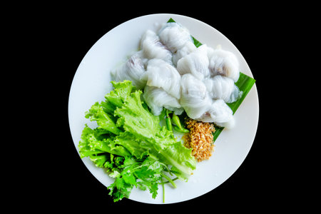 Die cut of Thai Steamed Pork Dumplings on black isolated.