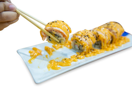 Die cut of Salmon rolls, Delicious sushi with fish fillet, cream cheese, on white isolated.の写真素材