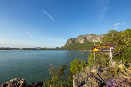 Muang Prachuap Khirikhan, THAILAND - December 31, 2023: View of Khao Ta Monglai Forest Park. Prachuap Khiri Khan Province, with beautiful mountains and sky, Attraction cave have beautiful color spotlight, very famous for tourist.のeditorial素材