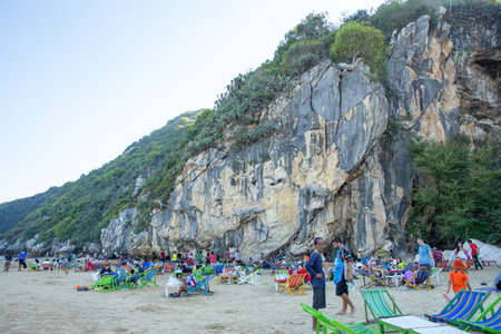 Pranburi, Prachuap Khiri Khan THAILAND - January 1, 2024: View of Khao Kalok beach in Pranburi Province, Thailand, with beautiful mountains and sky. Attraction cave have beautiful color spotlight, very famous for tourist.のeditorial素材