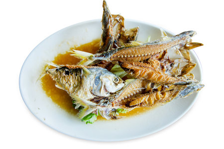 Die cut of Fried mackerel scorched with fish sauce on white isolated.の写真素材