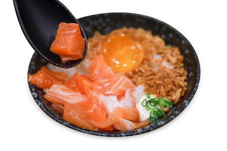 Die cut of rice with Pickled Egg Yolk and fresh salmon on white isolated.の写真素材