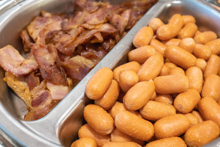 hot dog with crispy bacon in the portionの写真素材