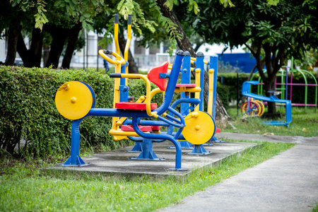 The yellow, red, blue exercise machine on the lawn.