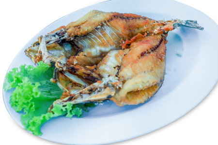 Die cut of Deep-fried Sea bass with Fish Sauce on white isolatedの写真素材