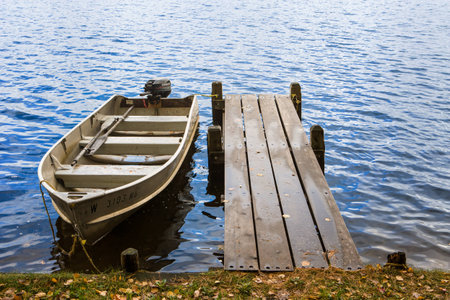 Row Boat at a Dock on a Beach at a Lake or Riverの写真素材