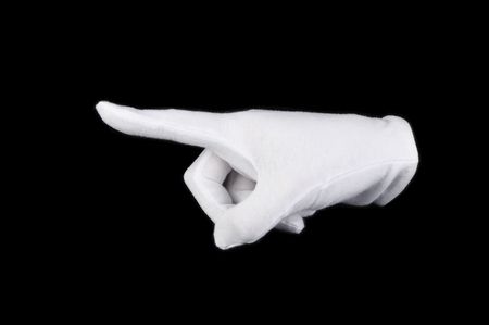 white-gloved hand on a black backgroundの写真素材