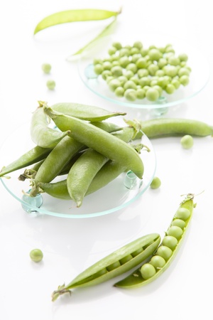 still life of fresh, ripe peas with peas on a white backgroundの写真素材