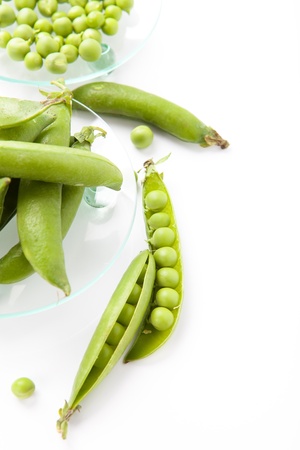 still life of fresh, ripe peas with peas on a white backgroundの写真素材