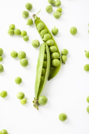 still life of fresh, ripe peas with peas on a white backgroundの写真素材