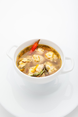 Vegetable soup with meatballs and potato on a white backgroundの写真素材