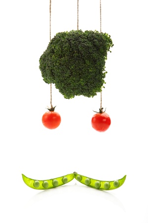 stylization of the face of vegetables on a white backgroundの写真素材