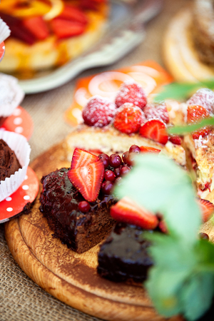 Freshly baked homemade berry pies cut into chunksの写真素材