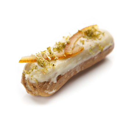 exquisite cream dessert eclair on a white background