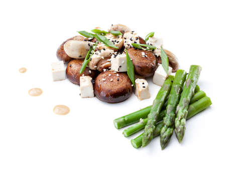 mushrooms with asparagus and tofu on a white backgroundの写真素材